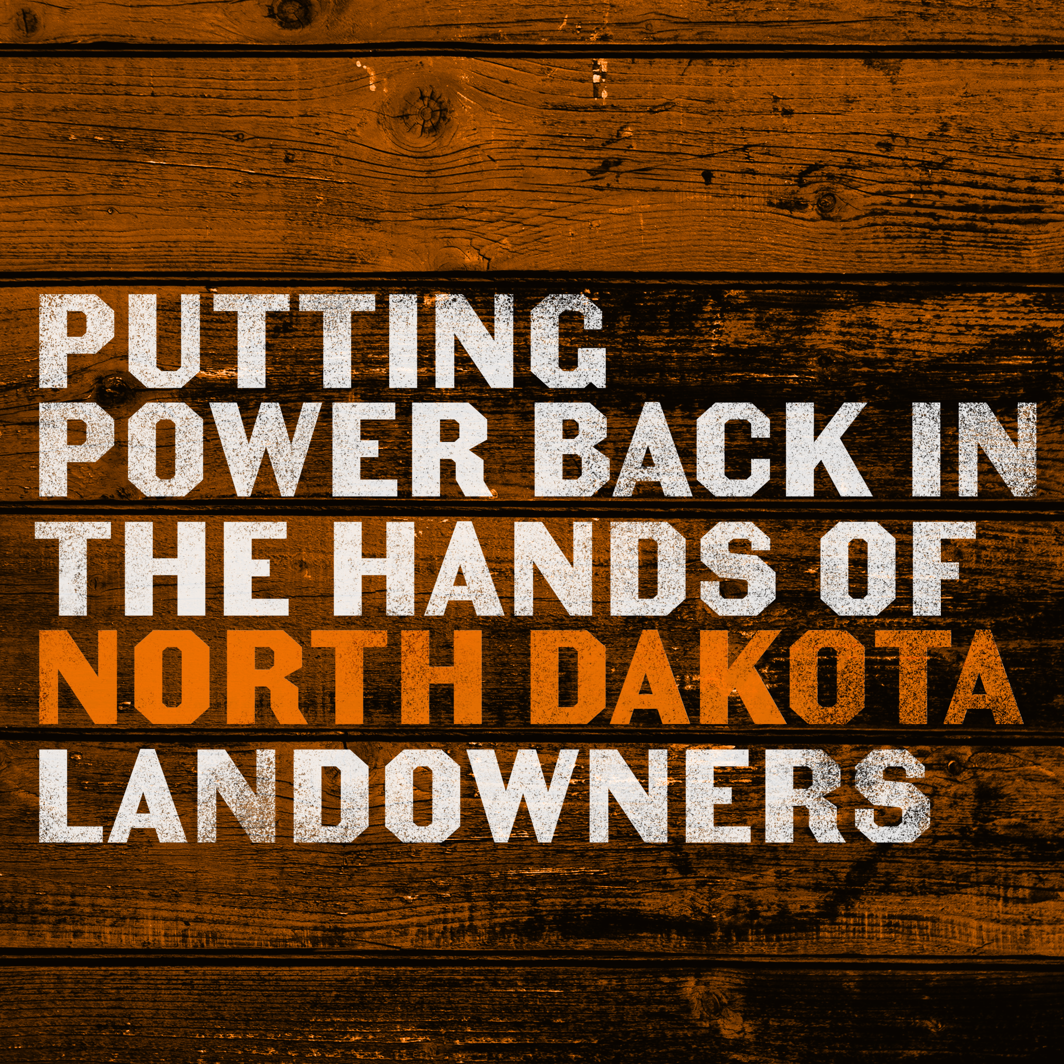 Orange barn wood with white text PUTTING THE POWER BACK IN THE HANDS OF NORTH DAKOTA LANDOWNERS.