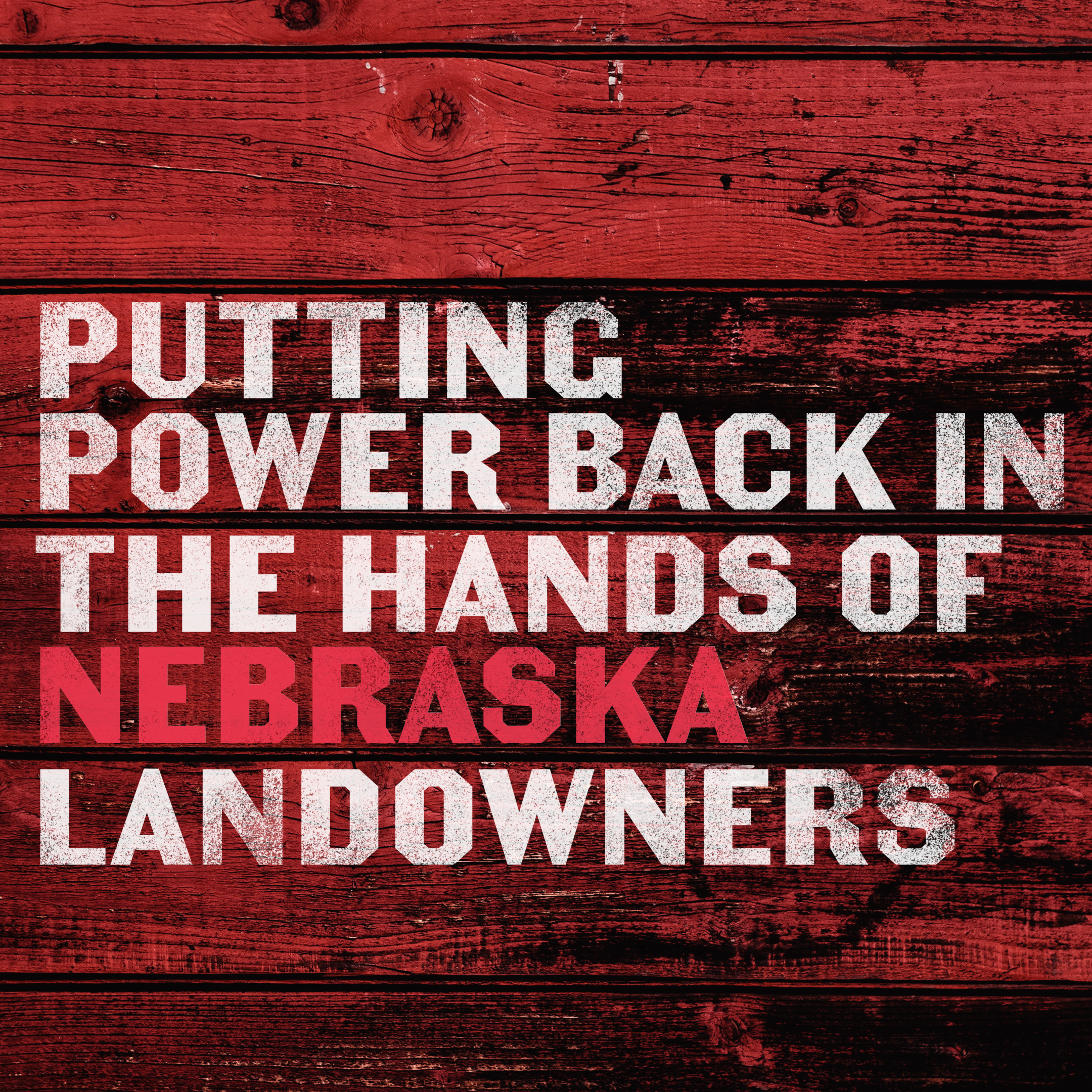 Red barn wood with white text PUTTING THE POWER BACK IN THE HANDS OF NEBRASKA LANDOWNERS.